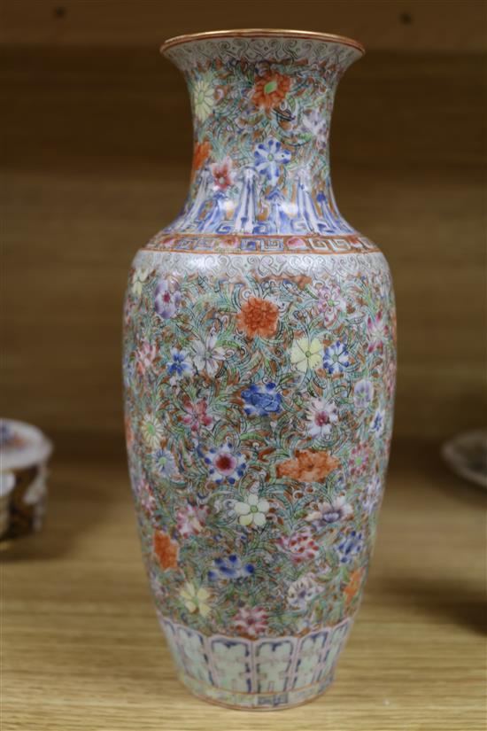 A Chinese famille rose small millefleur vase, Republic period, bearing a Qianlong mark height 23cm